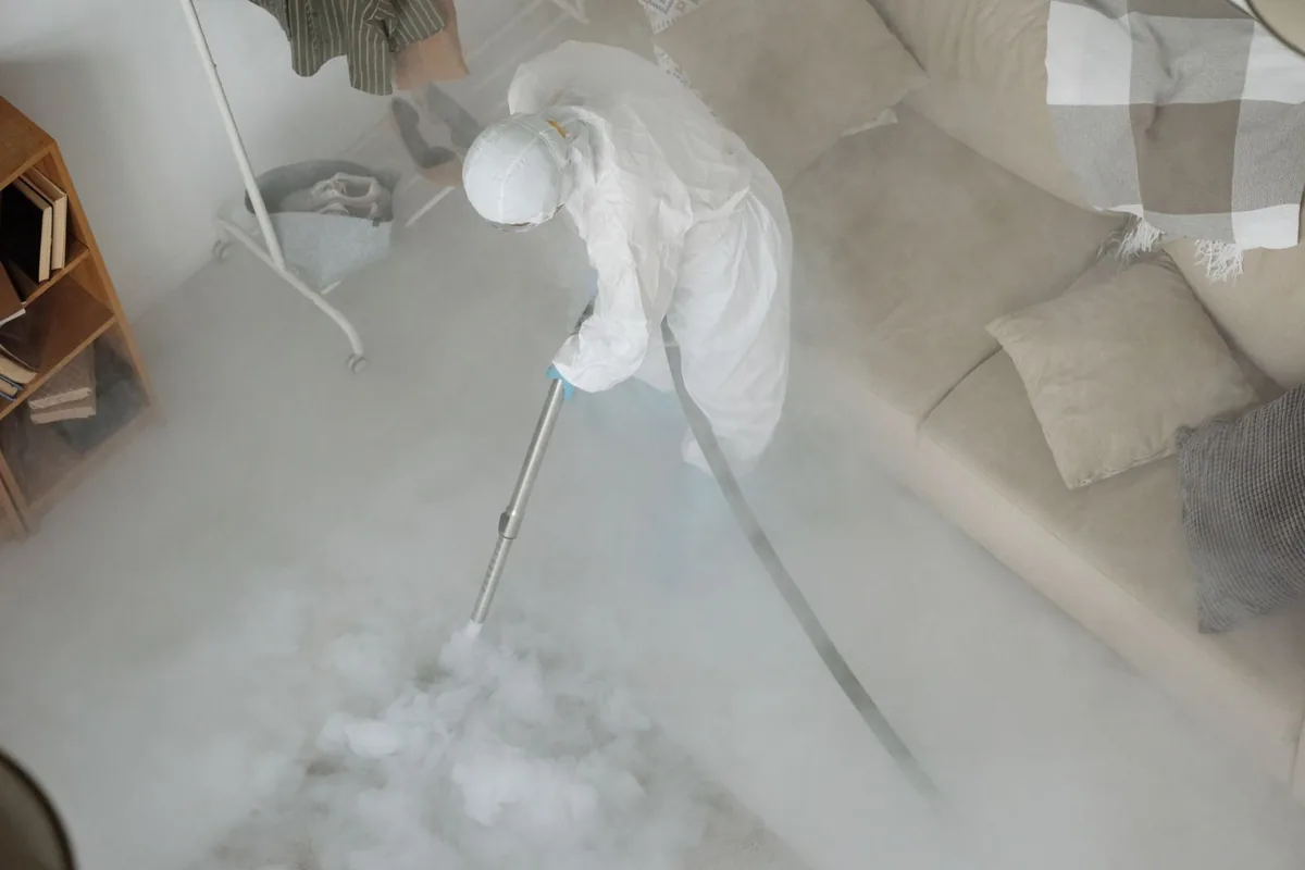 Biohazard cleanup technician in protective equipment, Sandia Vista, Albuquerque, NM